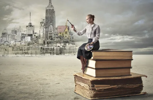 woman on books painting buildings